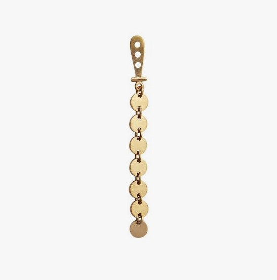 Petit coins behind earring