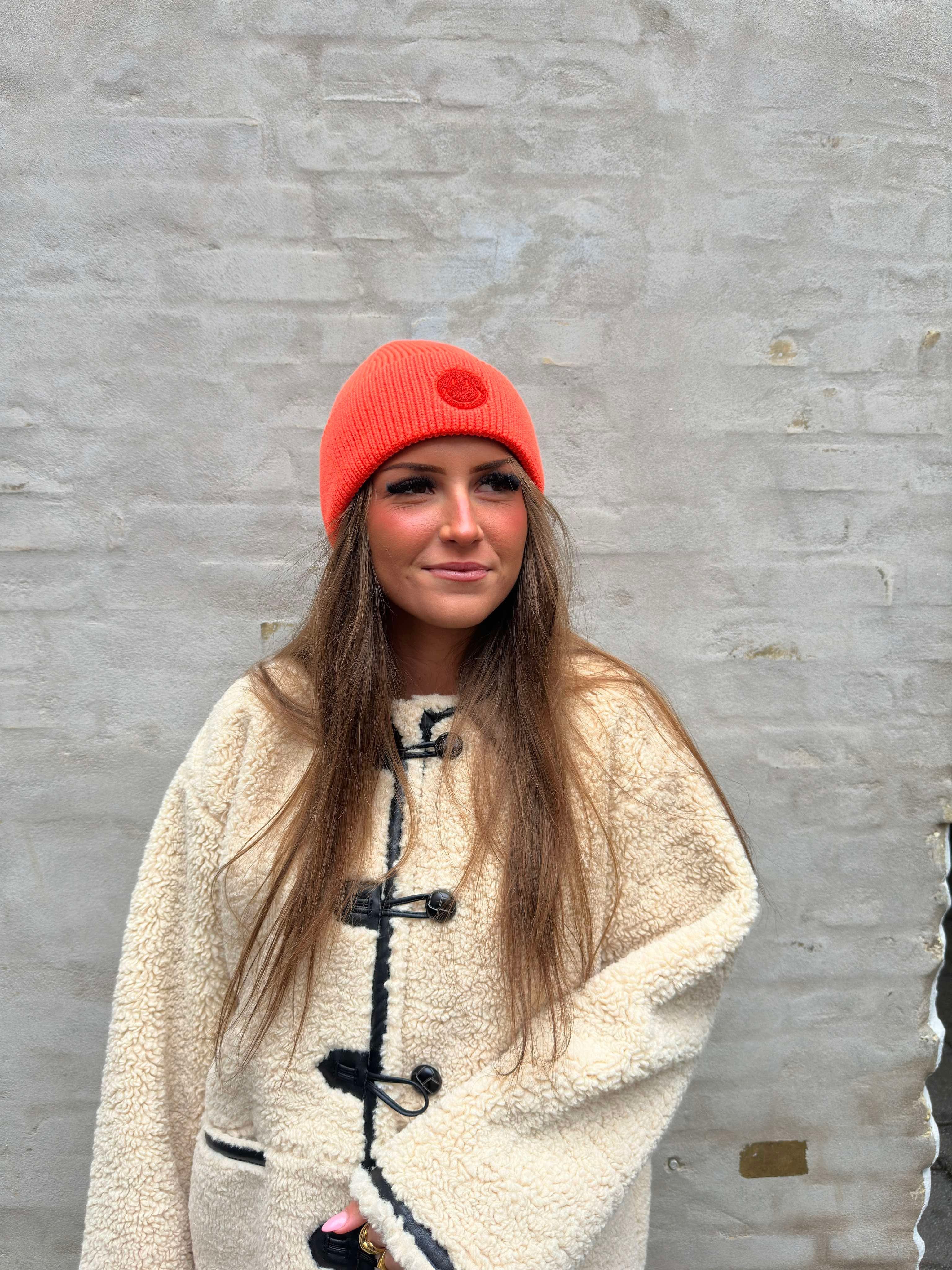 Smiley knitted hat orange